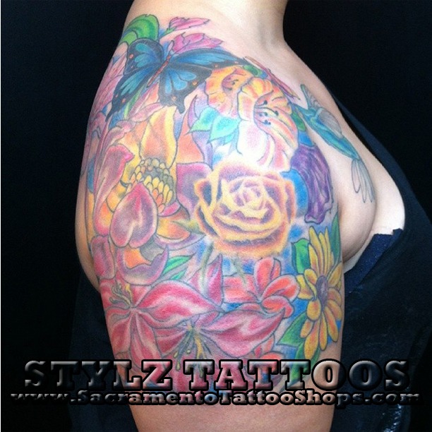 flowers on shoulder tattoo