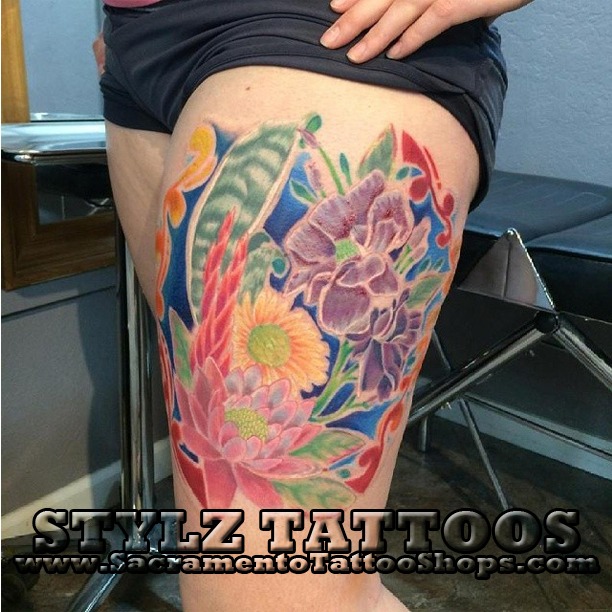 flowers on leg tattoo water color