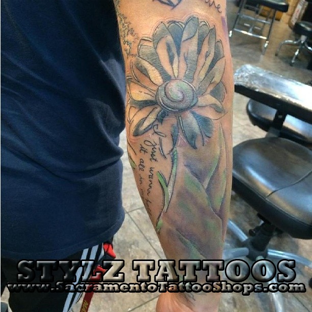 flower tattoo on the elbow